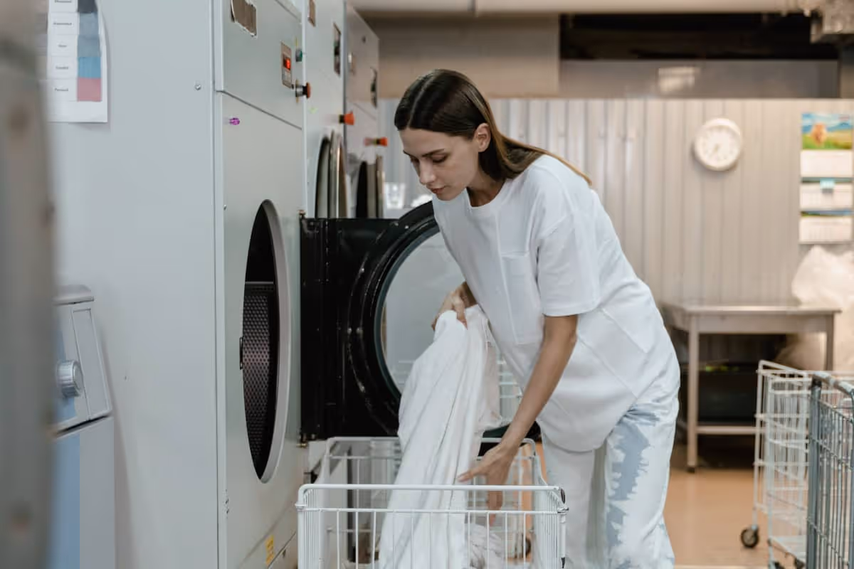 Freshly washed clothes being handled with care
